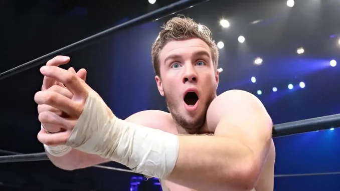 Will Osprey lehnt sich ans Ringseil und sieht erstaunt aus