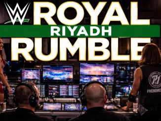 WWE Mitarbeiter sowie AJ Styles blicken auf Monitore