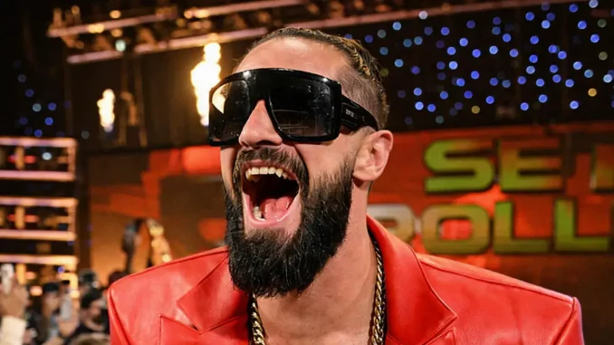 Seth Rollins trägt eine Sonnenbrille und lacht